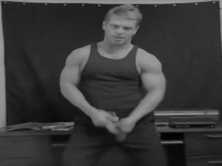 Muscle jock police officer strips and teases
